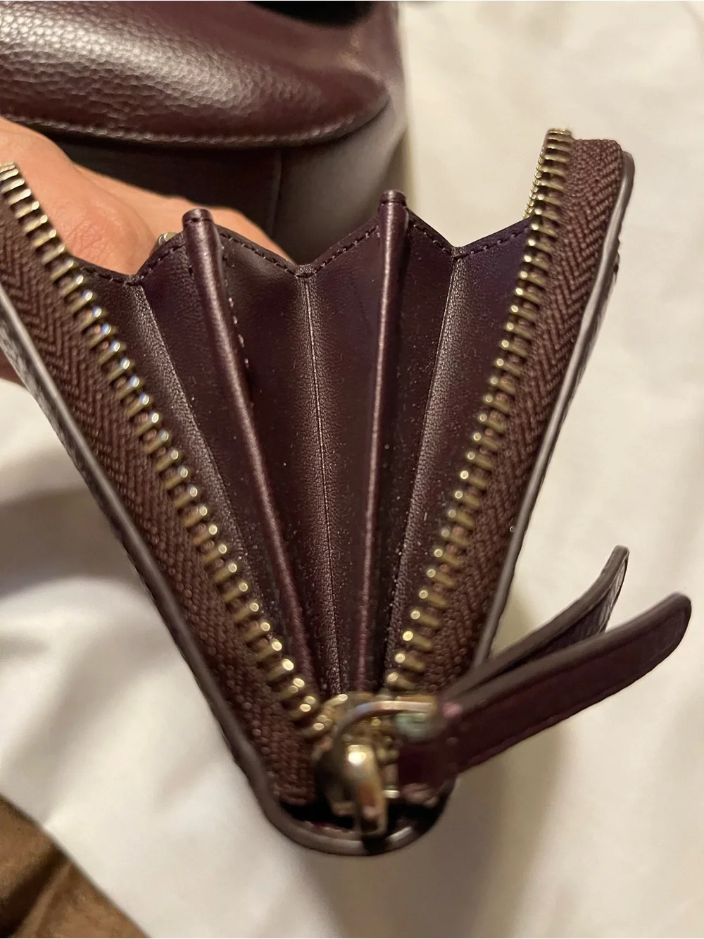 kate spade Pebble Leather Shoulder Bag with matching wallet in Deep Burgundy.
